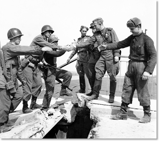 Figure 9. Allan Jackson International News Photo. This posed photo symbolic of the Americans meeting the Russians was one of the two most famous photographs of WWII. It was posed and taken by Allan Jackson former International News war correspondent.